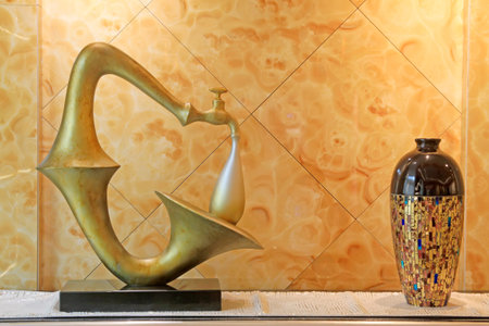 faucet horn shape ornaments and ceramic inside, closeup of photoのeditorial素材