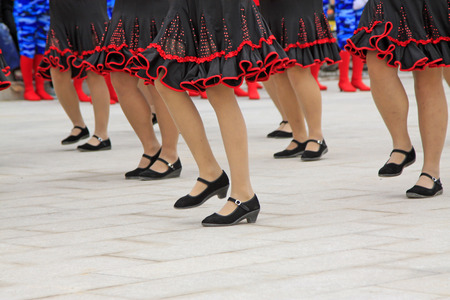 black skirt and black shoes, closeup of photoの写真素材