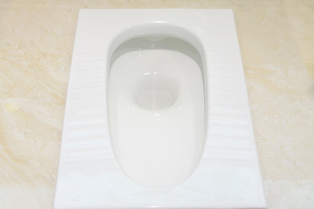 Ceramic squat toilets, closeup of photoの写真素材