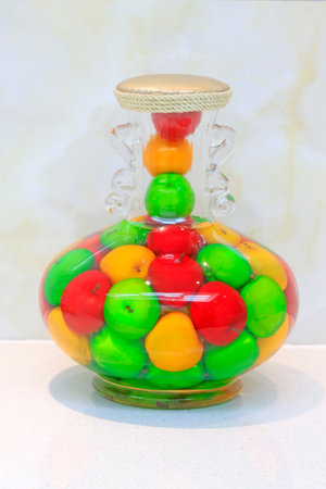 fruit in glass bottles, closeup of photoの写真素材