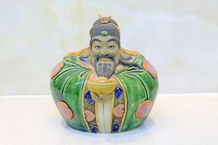 Ceramic mammon sculpture, closeup of photoの写真素材