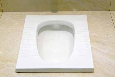 Ceramic squat toilets, closeup of photoの写真素材