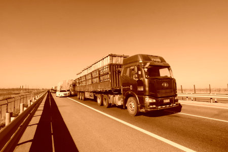 TIANJIN - DECEMBER 9: The heavy duty trucks stopped on the highway.のeditorial素材