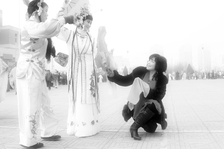 LUANNAN COUNTY - FEBRUARY 15: People wearing colorful clothes, performing yangko dance in the street, during the Chinese Lunar New Year, February 15, 2014, Luannan County, Hebei Province, China.のeditorial素材