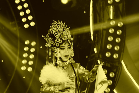 LUANNAN COUNTY - JANUARY 6: The actor dressed in red on the stage, in the ChengZhaoCai grand theater, January 6, 2014,luannan county, hebei province, china.のeditorial素材