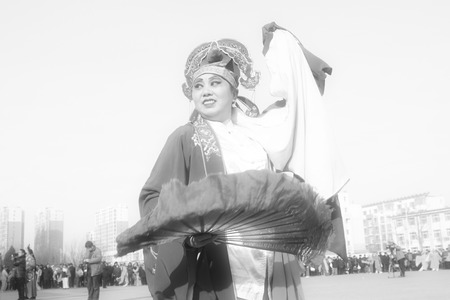 LUANNAN COUNTY - FEBRUARY 11: People wearing colorful clothes, performing yangko dance in the street, during the Chinese Lunar New Year, February 11, 2014, Luannan County, Hebei Province, China.のeditorial素材