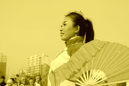 LUANNAN COUNTY - FEBRUARY 11: People wearing colorful clothes, performing yangko dance in the street, during the Chinese Lunar New Year, February 11, 2014, Luannan County, Hebei Province, China.のeditorial素材