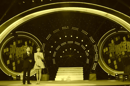 LUANNAN COUNTY - JANUARY 7: The CCTV's opera channel host Zhao baole and liu chang on the stage, in the ChengZhaoCai grand theater, January 7, 2014,luannan county, hebei province, china.のeditorial素材