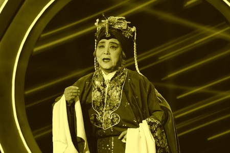 LUANNAN COUNTY - JANUARY 7: The PingJu older women image on the stage, in the ChengZhaoCai grand theater, January 7, 2014,luannan county, hebei province, china.のeditorial素材