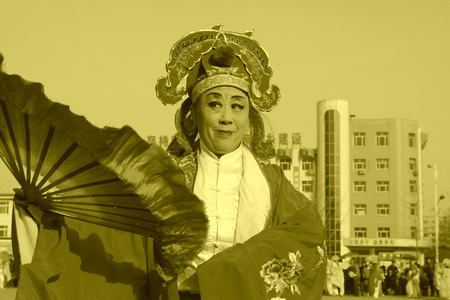 LUANNAN COUNTY - FEBRUARY 11: People wearing colorful clothes, performing yangko dance in the street, during the Chinese Lunar New Year, February 11, 2014, Luannan County, Hebei Province, China.のeditorial素材