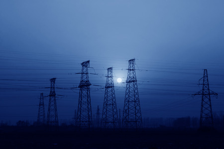electric tower in the evening sky, power transmission facilitiesの写真素材
