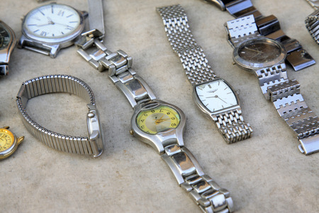 Old watch and bracelet in the booth, closeup of photoのeditorial素材