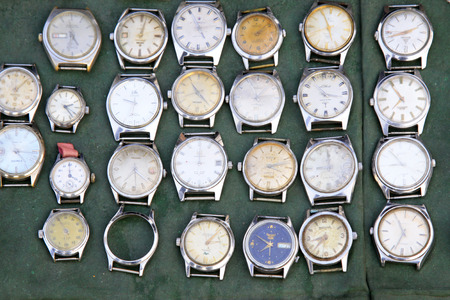 Old watch in the booth, closeup of photoのeditorial素材