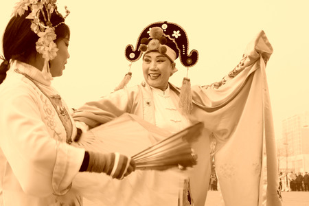 LUANNAN COUNTY - FEBRUARY 15: Performer wearing colorful clothes, performing yangko dance in the street, during the Chinese Lunar New Year, February 15, 2014, Luannan County, Hebei Province, China.のeditorial素材