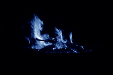 flame burning in the night, closeup of photoの写真素材
