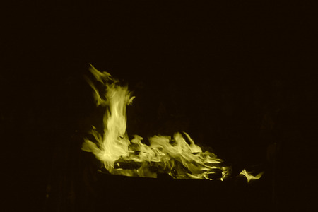 flame burning in the night, closeup of photoの写真素材