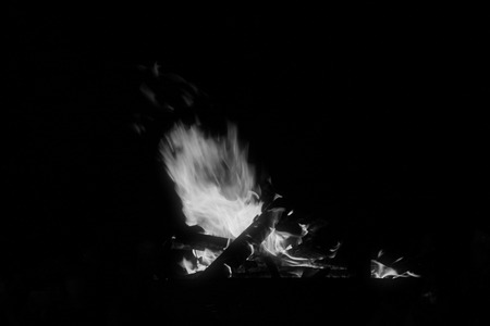 flame burning in the night, closeup of photoの写真素材