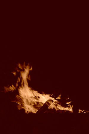 flame burning in the night, closeup of photoの写真素材