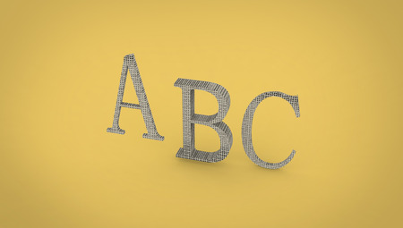 ABC rendering letters on a yellow background, closeup of photoの写真素材