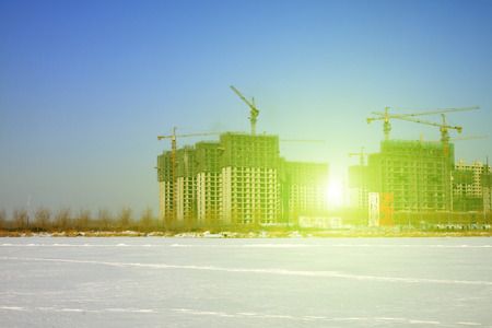 Unfinished buildings under construction during winterの写真素材