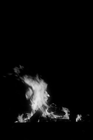 flame burning in the night, closeup of photo