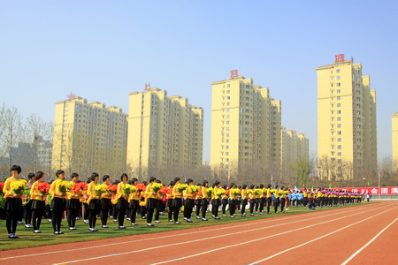 LUANNAN COUNTY - APRIL 14: Group gymnastic performance at the athletics meeting, April 14, 2015, Luannan County, Hebei Province, Chinaのeditorial素材