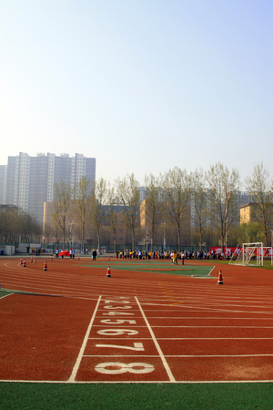LUANNAN COUNTY - APRIL 14: red plastic playground in a middle school, April 14, 2015, Luannan County, Hebei Province, Chinaのeditorial素材