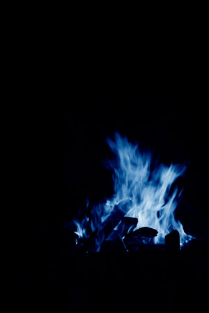 flame burning in the night, closeup of photoの写真素材