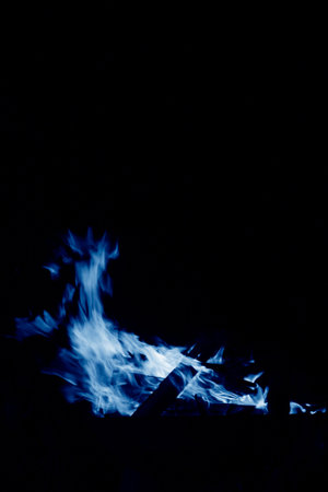flame burning in the night, closeup of photoの写真素材