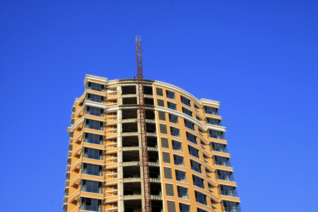 Unfinished buildings in the blue sky, closeup of photoのeditorial素材