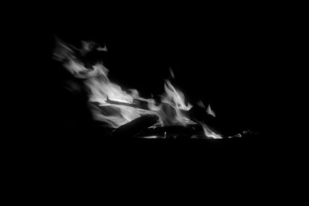 flame burning in the night, closeup of photo