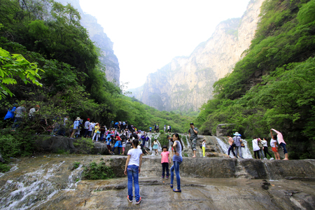 Jiaozuo city - May 2: Visitors playing in the stream yuntai mountain scenic spot, on May 2, 2015, jiaozuo city, henan province, China.のeditorial素材