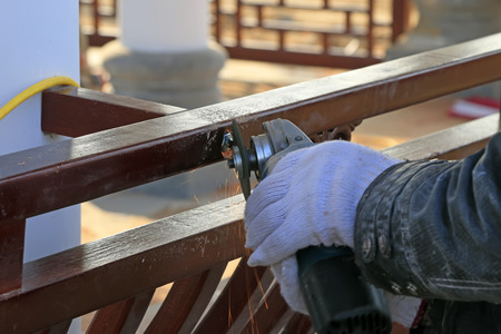 Grinding wheel grinding metal parts, closeup of photoの写真素材