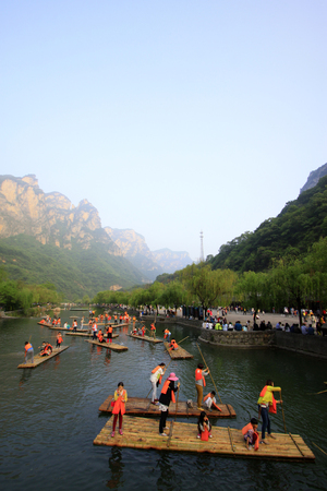 Jiaozuo - May 2: tourists driving the bamboo raft, yuntai mountain scenic spot, on May 2, 2015, jiaozuo, henan province, China.のeditorial素材