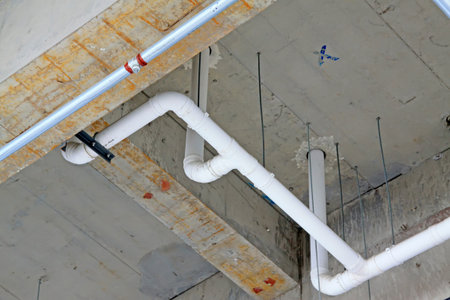 White PVC pipe in the roof, closeup of photo