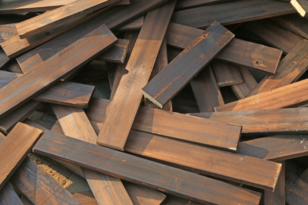 Heat treatment wood stacked together, closeup of photoの写真素材
