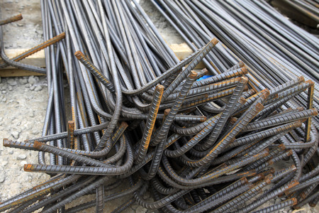 twisted steel at a construction site, closeup of photoの写真素材