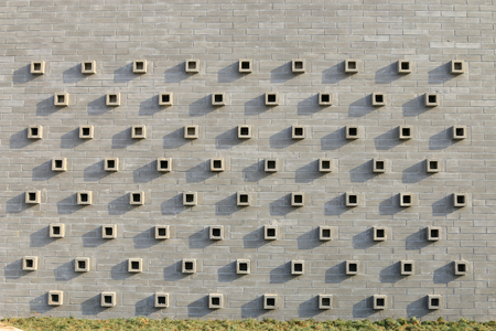 Grey wall adornment modelling, closeup of photoの写真素材