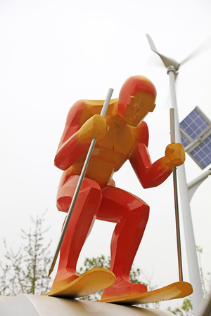 Wind turbines and ski sculpture in a parkのeditorial素材