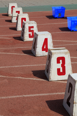 track number in the red plastic runwayの写真素材