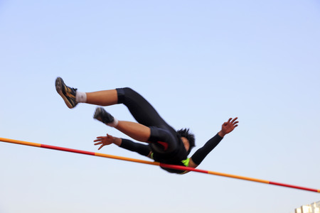 man high jump athlete in the playgroundのeditorial素材