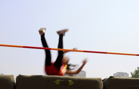 woman high jump athlete in the playgroundのeditorial素材