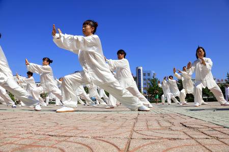 Tangshan - August 8: Chinese Kungfu-Tai Chi exercise in the park, August 8, 2016, tangshan city, hebei province, Chinaのeditorial素材