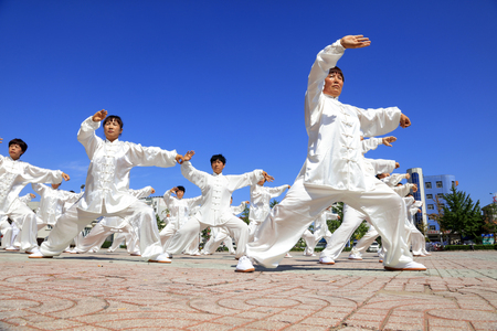 Tangshan - August 8: Chinese Kungfu-Tai Chi exercise in the park, August 8, 2016, tangshan city, hebei province, Chinaのeditorial素材