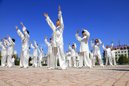 Tangshan - August 8: Chinese Kungfu-Tai Chi exercise in the park, August 8, 2016, tangshan city, hebei province, Chinaのeditorial素材