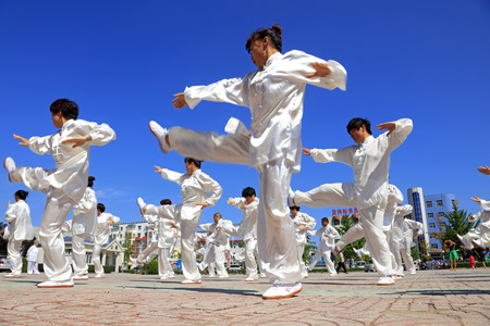 Tangshan - August 8: Chinese Kungfu-Tai Chi exercise in the park, August 8, 2016, tangshan city, hebei province, Chinaのeditorial素材