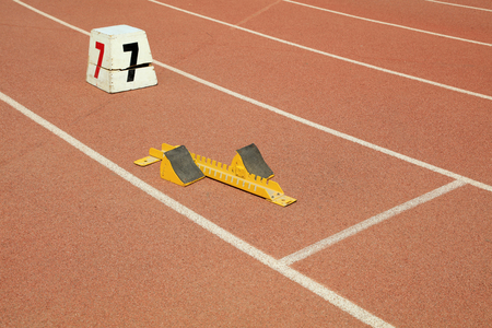 starting block and track number on plastic playgroundの写真素材
