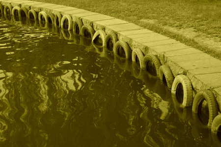 color tyres by the river in a park, closeup of photoの写真素材