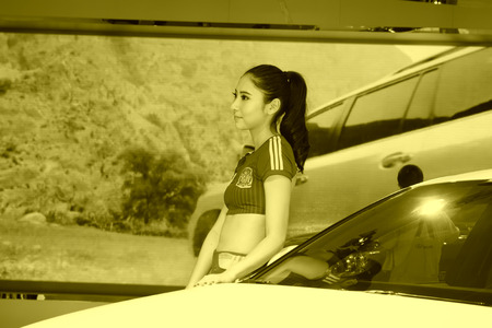 TANGSHAN - MAY 31: Beauty model in a car market on may 31, 2014, Tangshan city, Hebei Province, Chinaのeditorial素材