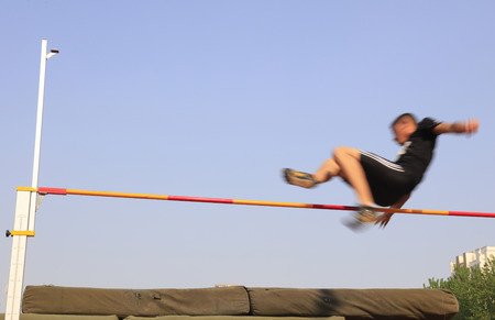men high jump athletes in the playgroundのeditorial素材